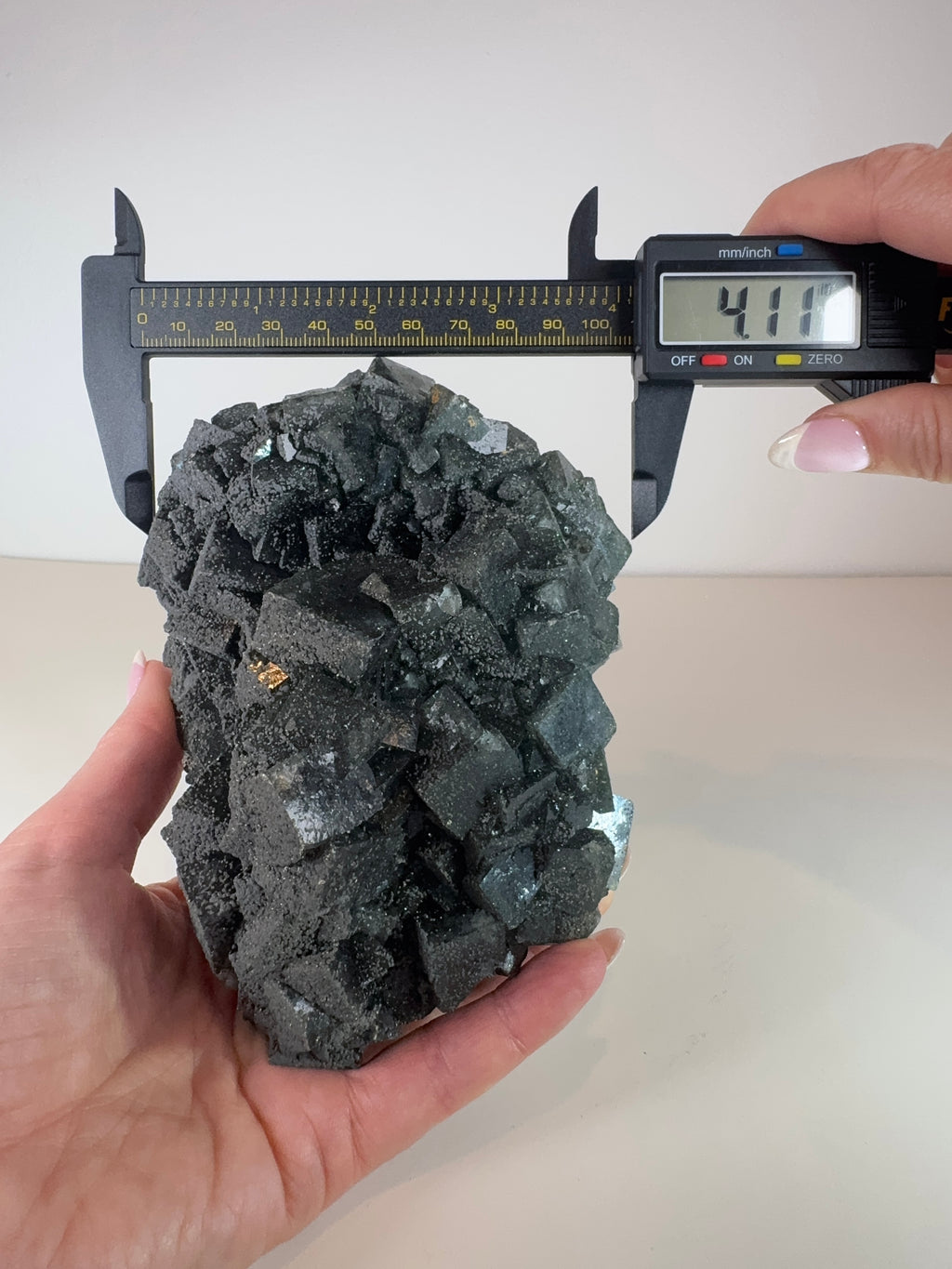 Dark Green Cubic Fluorite and Pyrite on Black Metal Stand