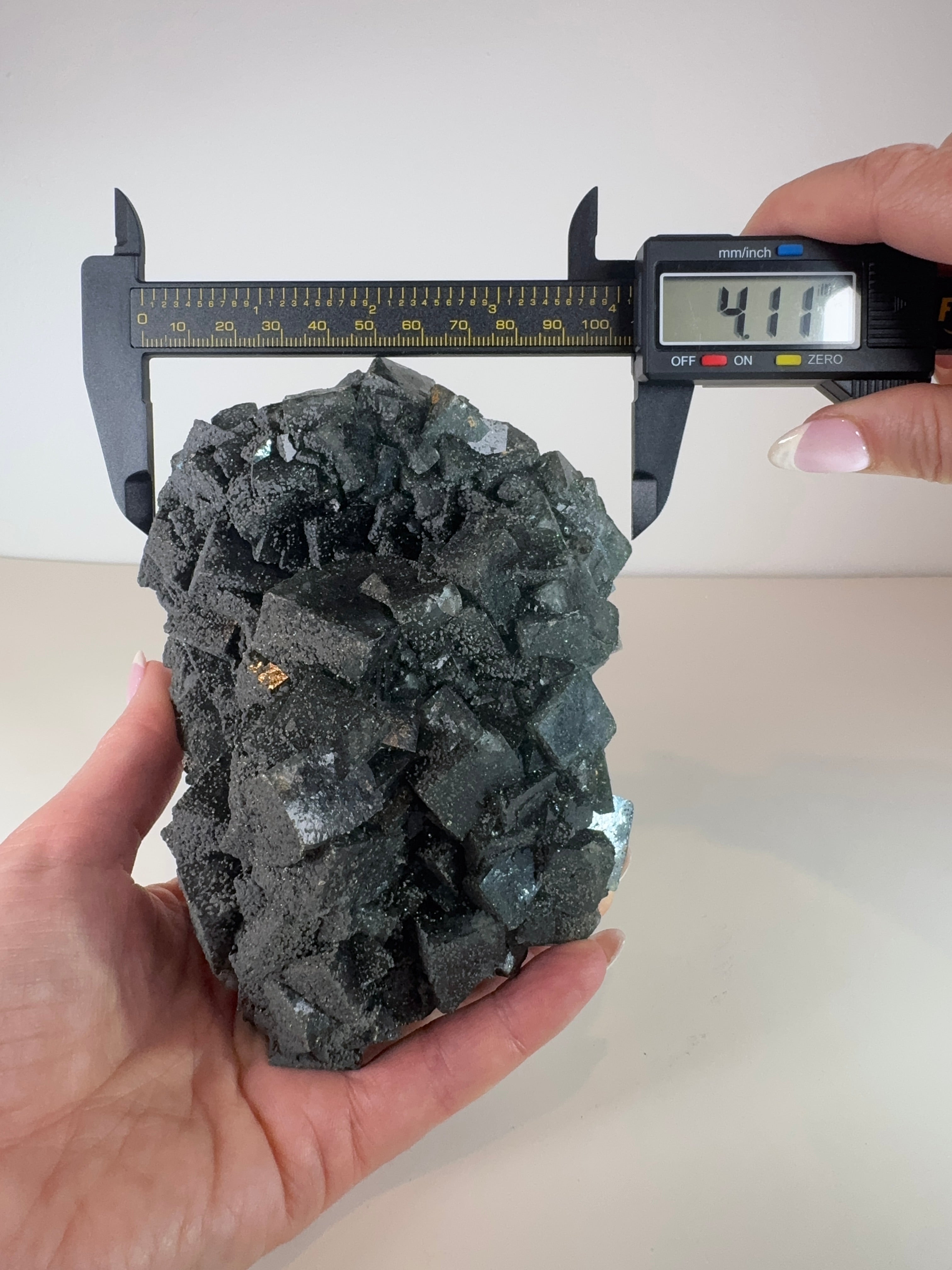 Dark Green Cubic Fluorite and Pyrite on Black Metal Stand